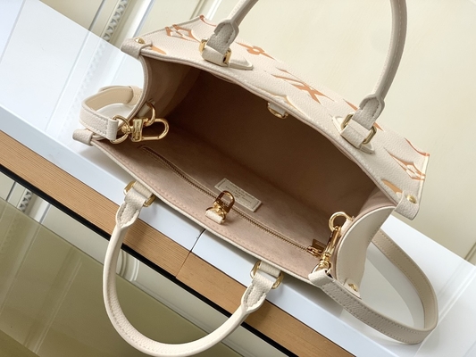 Kremowa szafranowa gigantyczna torba z monogramem OnTheGo MM Louis Vuitton na iPada Mini