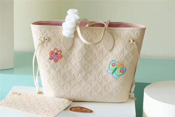 Markowa torebka damska Neverfull MM Monogram Empreinte z kwiatową intarsją