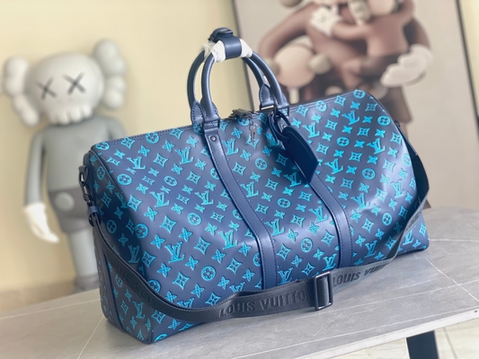 Duża markowa torba męska Keepall BANDOULIÈRE 50 niebieskich toreb Boston