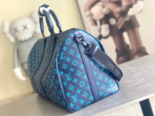 Duża markowa torba męska Keepall BANDOULIÈRE 50 niebieskich toreb Boston